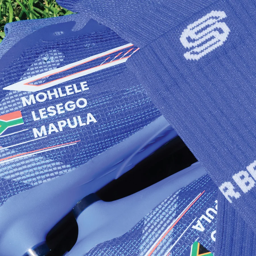 Boot ID transfer sheet detail next to a Strapzy's grip sock
