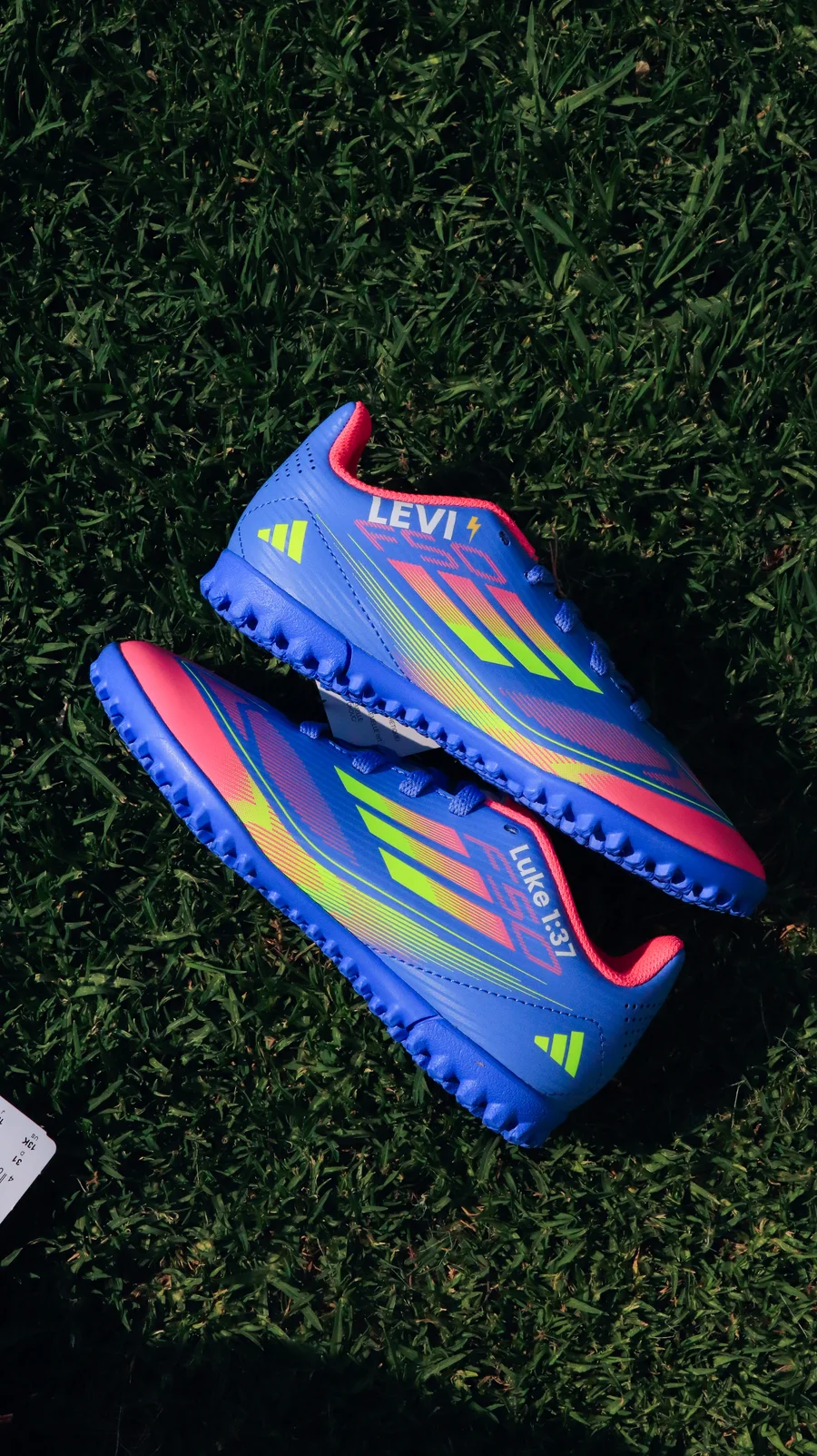 Personalised blue and pink boots with player name