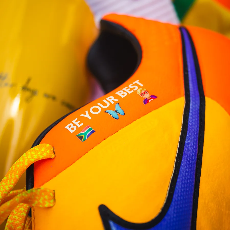Boot ID text, flag and emoji transfer applied to an orange boot