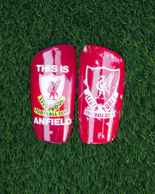 Red Liverpool shin pads: This Is Anfield and the retro crest