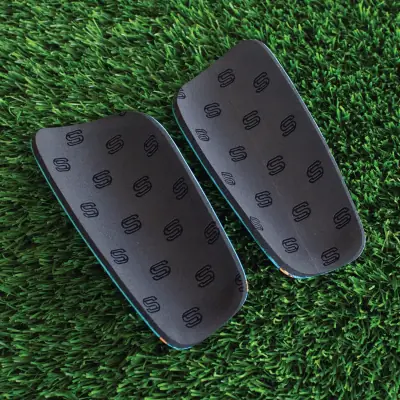 Back of the shin pads: soft black EVA foam lining with S logos